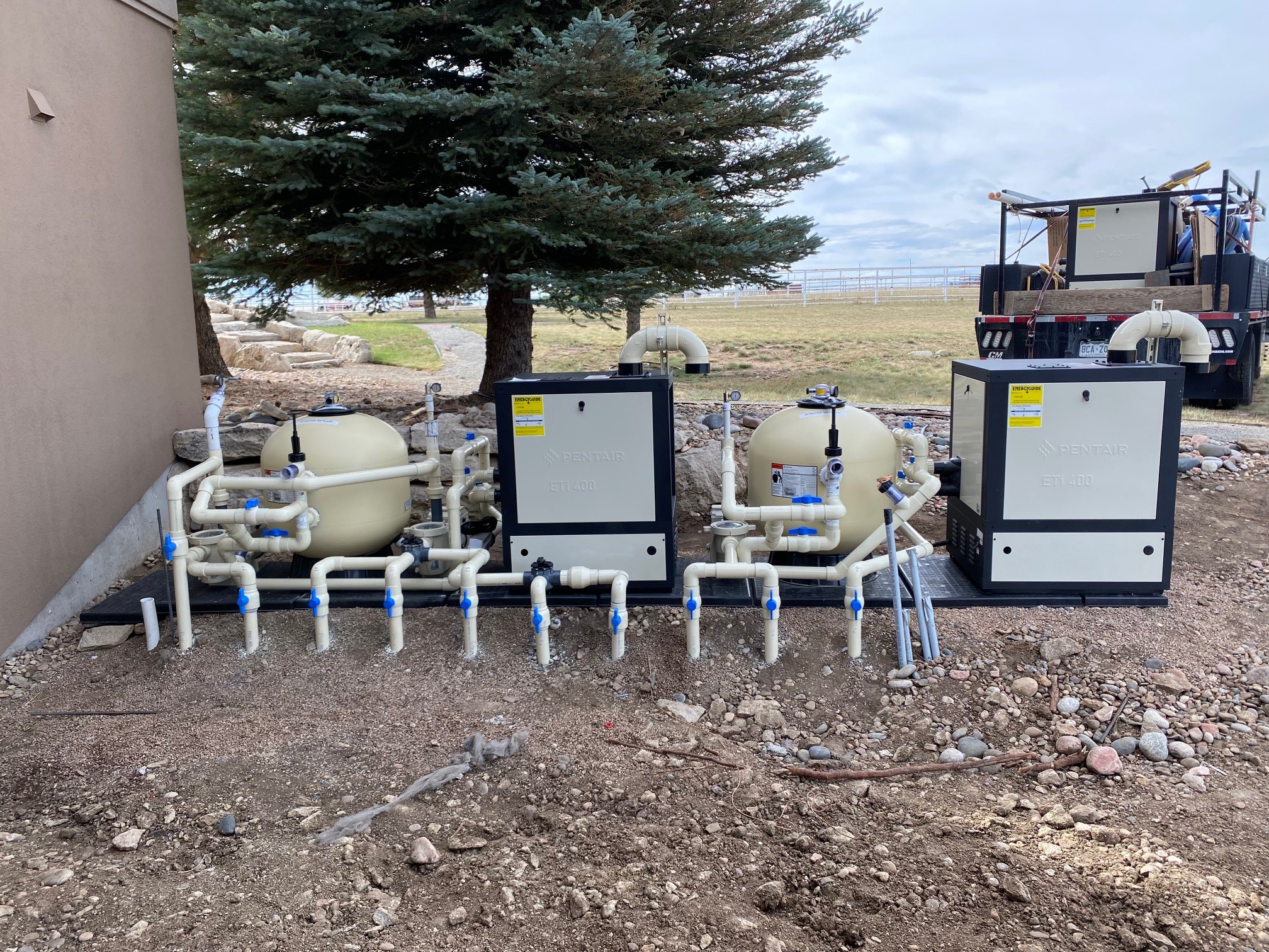 Swimming Pool and Spa Combo with Tiki Bar at Night - Pueblo, CO