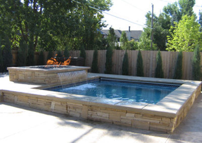 Custom Spa With Firepit and Waterfall